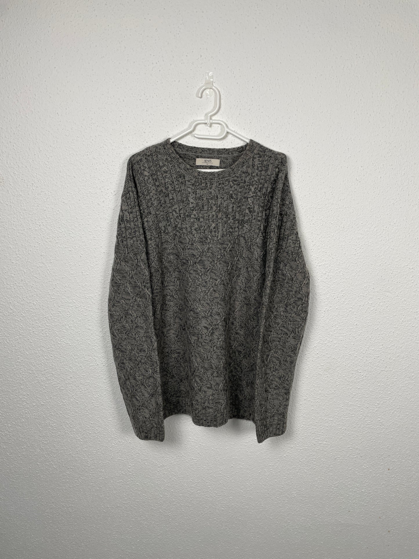 Grey cable-knit sweater by AW85.