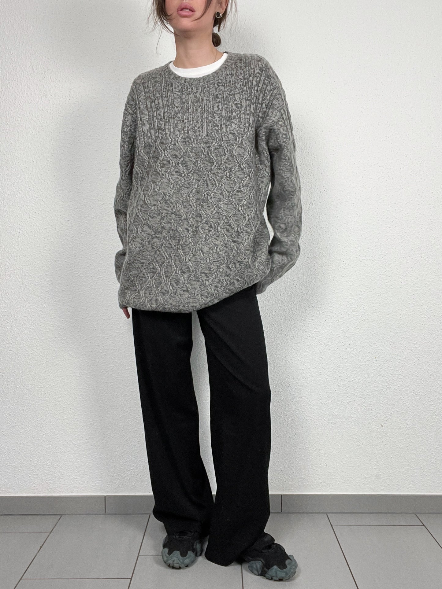 Grey cable-knit sweater by AW85.